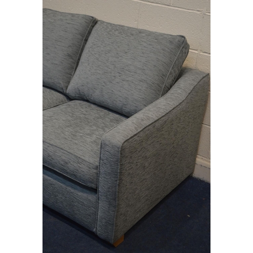 1203 - A GREY UPHOLSTERED TWO SEATER SOFA BED