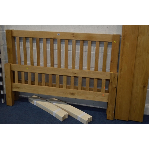 1204 - A LIGHT OAK 4' 6'' BEDFRAME, with side rails and slats, together with an oak full length mirror, on ... 