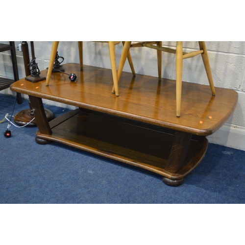 1208 - A PAIR OF ERCOL PRINCE OF WALES CHAIRS (partially stripped) together with an oak coffee table, a mod... 