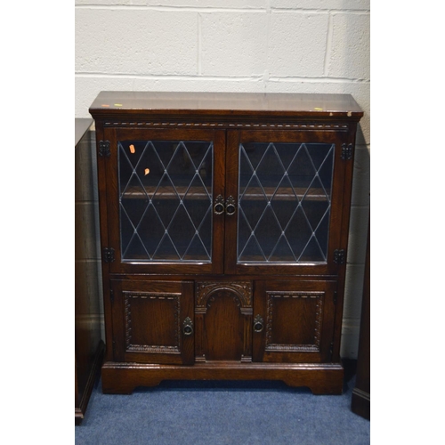 1209 - AN OAK LEAD GLAZED TWO DOOR BOOKCASE (sd), a similar corner cupboard and a hi fi cabinet (3)