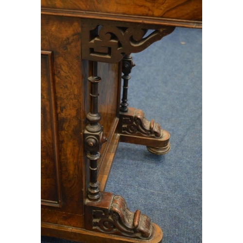 1211 - A LATE VICTORIAN WALNUT DAVENPORT, fretwork gallery on a hinged stationary compartment, a sloping li... 