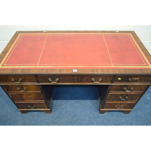 1234 - A MAHOGANY PEDESTAL DESK, with a red and gilt tooled leather inlay top, and nine various drawers, wi... 