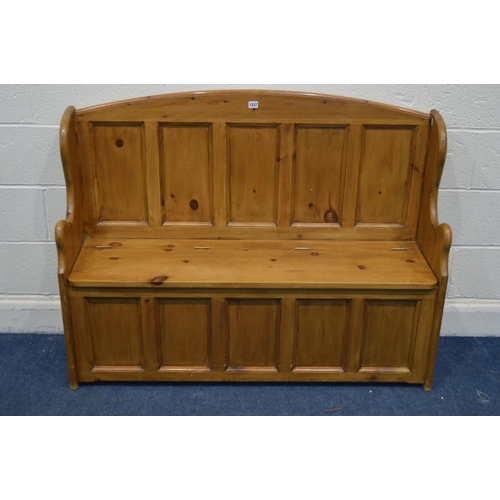 1237 - A PINE PANELLED HALL SETTLE, with a hinged storage compartnemtn, width 128cm