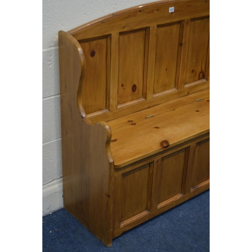 1237 - A PINE PANELLED HALL SETTLE, with a hinged storage compartnemtn, width 128cm