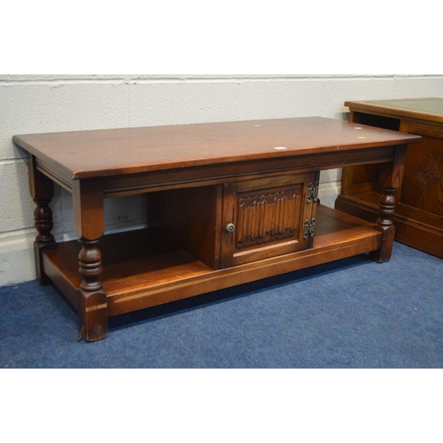 1238 - AN OLD CHARM OAK COFFEE TABLE, with a single linen fold door, width 122cm x depth 52cm x height 47cm... 