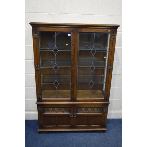 1245 - AN OLD CHARM OAK LEAD GLAZED TWO DOOR DISPLAY CABINET above double cupboard doors, width 108cm x dep... 