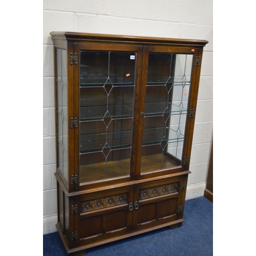 1245 - AN OLD CHARM OAK LEAD GLAZED TWO DOOR DISPLAY CABINET above double cupboard doors, width 108cm x dep... 