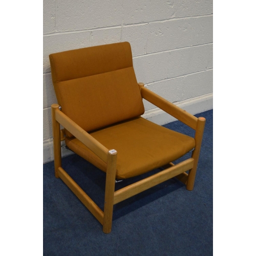 1253 - A 1970'S/80'S BEECH FRAMED OPEN ARMCHAIR, with Pirelli spring and russet coloured cushions