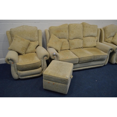 1256 - A BEIGE UPHOLSTERED FOUR PIECE LOUNGE SUITE, comprising a three seater settee, pair of armchairs and... 