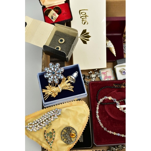 126 - A BOX OF COSTUME JEWELLERY to include various base metal brooches, rings, wristwatches, necklaces, e... 