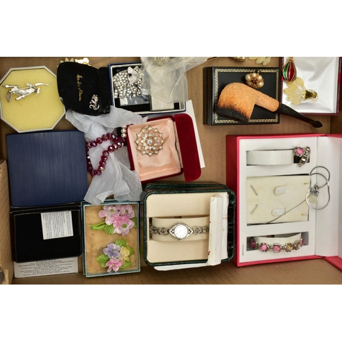 126 - A BOX OF COSTUME JEWELLERY to include various base metal brooches, rings, wristwatches, necklaces, e... 