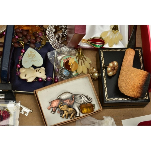 126 - A BOX OF COSTUME JEWELLERY to include various base metal brooches, rings, wristwatches, necklaces, e... 