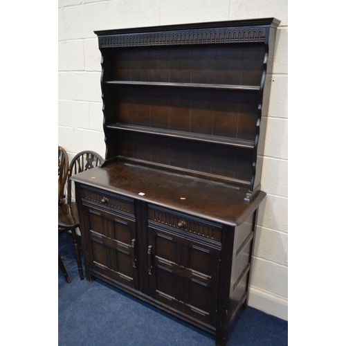 1265 - A DARK OAK DRESSER with two drawers, width 122cm x depth 46cm x height 178cm together with a matchin... 