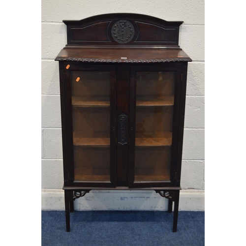 1268 - AN EARLY 20TH CENTURY MAHOGANY DOUBLE DOOR DISPLAY CABINET, with a raised back and two fixed shelves... 