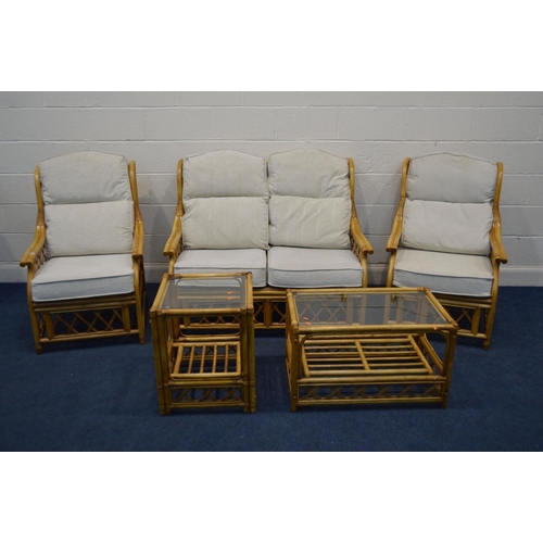 1275 - A WICKER FIVE PIECE CONSERVATORY SUITE, with oatmeal cushions, comprising a two seater settee, pair ... 