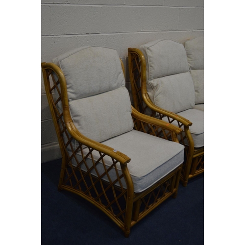 1275 - A WICKER FIVE PIECE CONSERVATORY SUITE, with oatmeal cushions, comprising a two seater settee, pair ... 