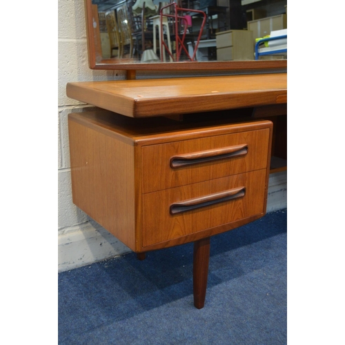 1280 - A G PLAN FRESCO TEAK DRESSING TABLE with a swinging rectangular mirror and four drawers flanking a d... 