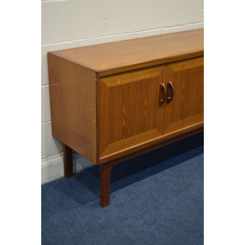 1282 - A G PLAN TEAK SIDEBOARD, with double cupboard doors and a single fall front cupboard door flanking t... 