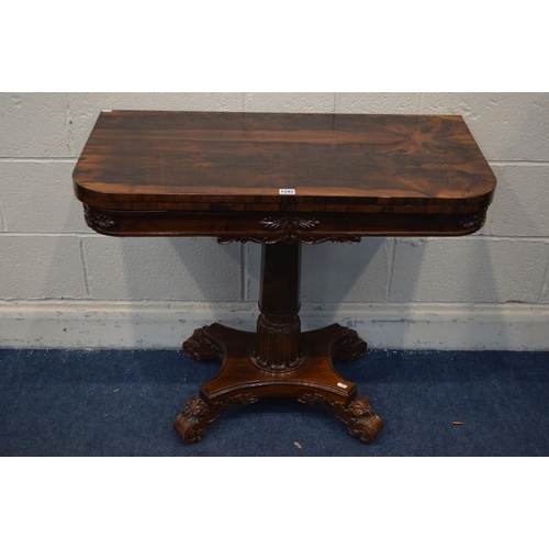 1297 - A 20TH CENTURY REGENCY STYLE ROSEWOOD CARD TABLE, rounded front corners with a fold over top, on a c... 