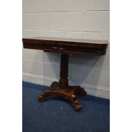 1297 - A 20TH CENTURY REGENCY STYLE ROSEWOOD CARD TABLE, rounded front corners with a fold over top, on a c... 