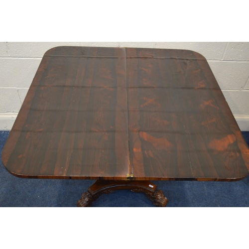 1297 - A 20TH CENTURY REGENCY STYLE ROSEWOOD CARD TABLE, rounded front corners with a fold over top, on a c... 