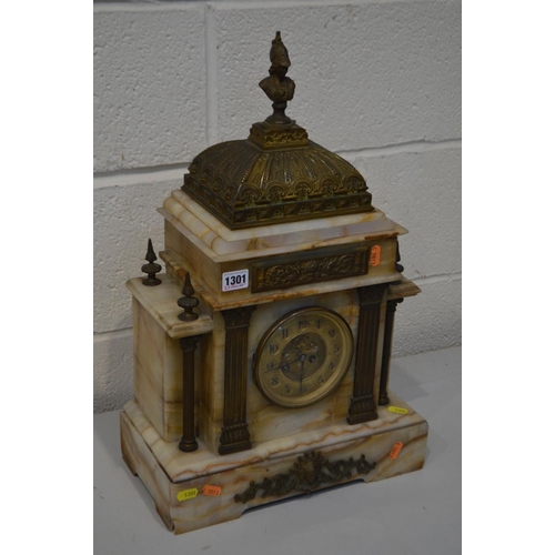 1301 - AN EARLY 20TH CENTURY MARBLE AND BRASS FRENCH MANTEL CLOCK, with a Roman figure finial, the brass di... 