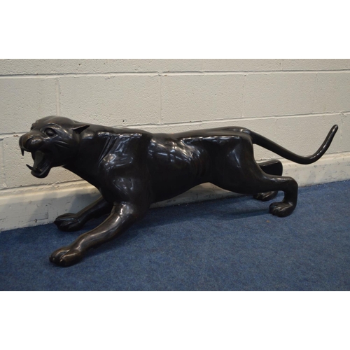 1316 - A BRONZE BLACK PANTHER SCULPTURE, length 159cm x height 49cm