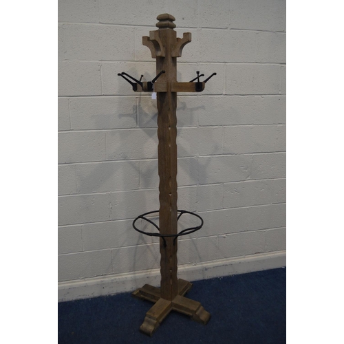 1317 - A LIMED OAK COAT/HAT STAND, height 199cm