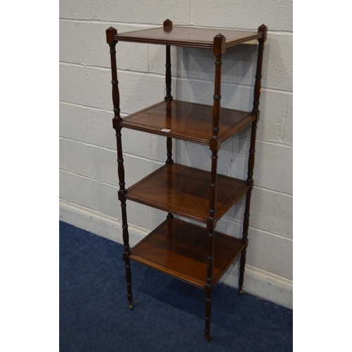 1320 - AN EDWARDIAN MAHOGANY FOUR TIER WHAT NOT, reeded edge to each tier united by turned uprights, on bra... 