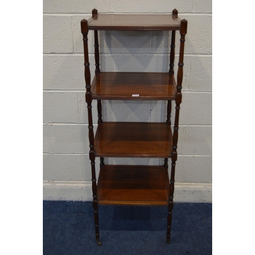 1320 - AN EDWARDIAN MAHOGANY FOUR TIER WHAT NOT, reeded edge to each tier united by turned uprights, on bra... 