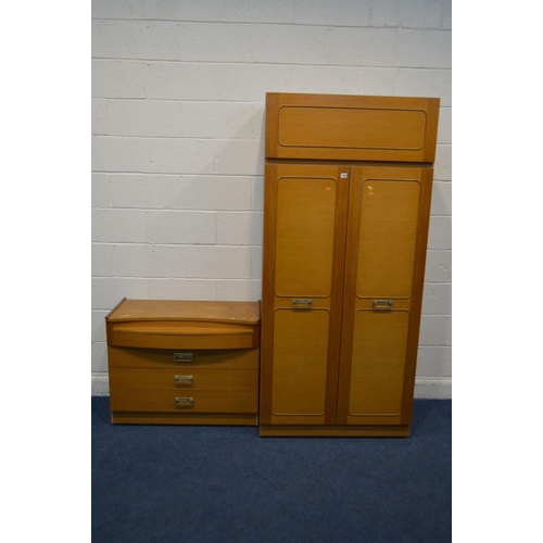 1328 - A 1970'S TEAK FINISH TWO PIECE BEDROOM SUITE, comprising a two door wardrobe and dressing chest of f... 