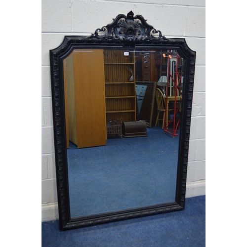 1331 - A LARGE LATE 20TH CENTURY EBONISED WOOD BEVELLED EDGE OVERMANTEL MIRROR, with a foliate and scrolled... 