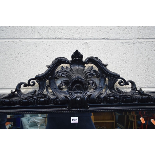 1331 - A LARGE LATE 20TH CENTURY EBONISED WOOD BEVELLED EDGE OVERMANTEL MIRROR, with a foliate and scrolled... 