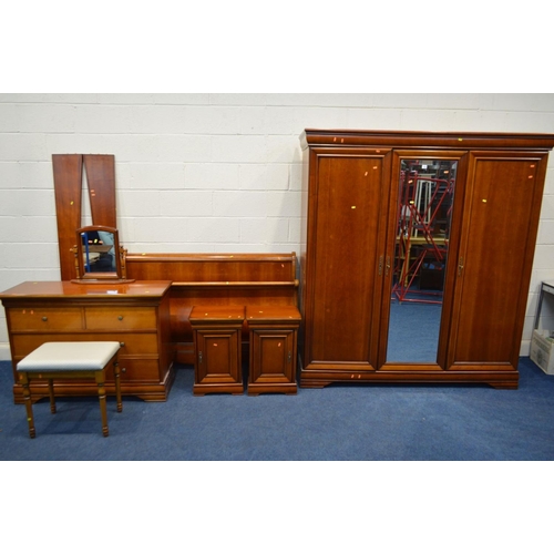 1333 - A CHERRYWOOD FRENCH SEVEN PIECE BEDROOM SUITE, comprising a mirrored three door wardrobe, width 178c... 