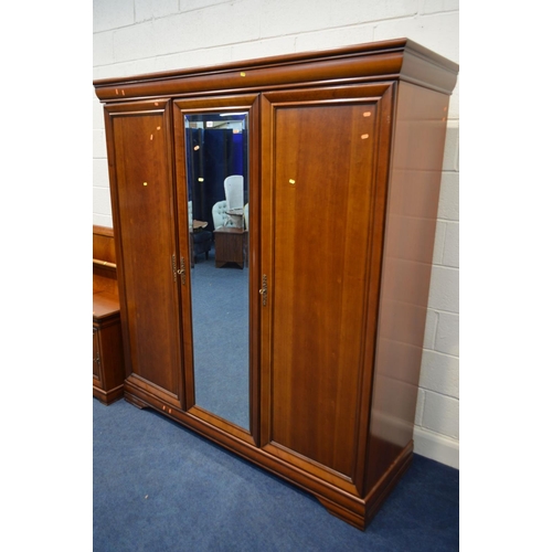 1333 - A CHERRYWOOD FRENCH SEVEN PIECE BEDROOM SUITE, comprising a mirrored three door wardrobe, width 178c... 