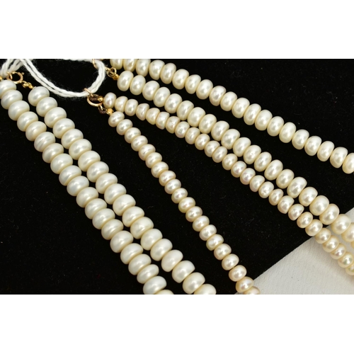 136 - THREE SETS OF CULTURED PEARL NECKLACES, the first with a strand of button pearls, fitted with a yell... 