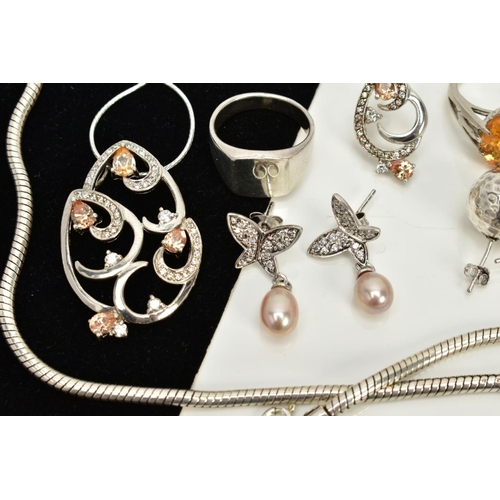 15 - A COLLECTION OF WHITE METAL ASSORTED JEWELLERY ITEMS to include an orange crystal and cubic zirconia... 