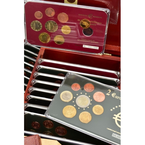 150 - SIX WOODEN CASES HOUSING TWELVE COMMEMORATIVE SETS OF EURO COINS each with different dates to includ... 