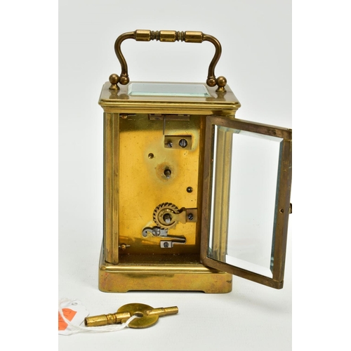 157 - A SMALL CARRIAGE CLOCK, within an open glass/brass case, white dial, Roman numerals, black hands, to... 