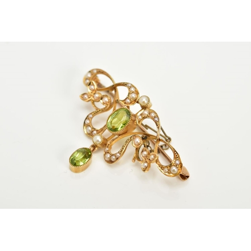 164 - AN EARLY 20TH CENTURY GOLD PERIDOT AND SEED PEARL BROOCH, measuring approximately 35mm in length, st... 