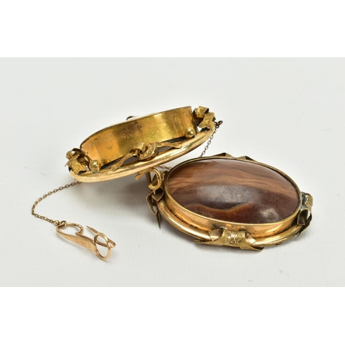 169 - TWO YELLOW METAL BROOCHES, to include a cameo swivel memorial brooch, the cameo depicting the three ... 