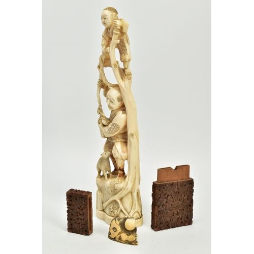 178 - A LATE 19TH CENTURY JAPANESE IVORY OKIMONO, carved as a child standing at the top of some branches w... 