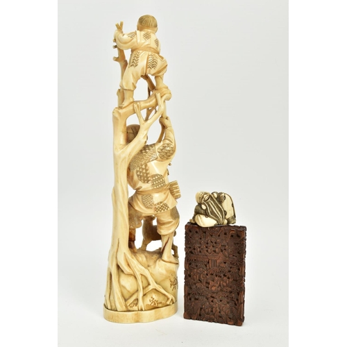 178 - A LATE 19TH CENTURY JAPANESE IVORY OKIMONO, carved as a child standing at the top of some branches w... 