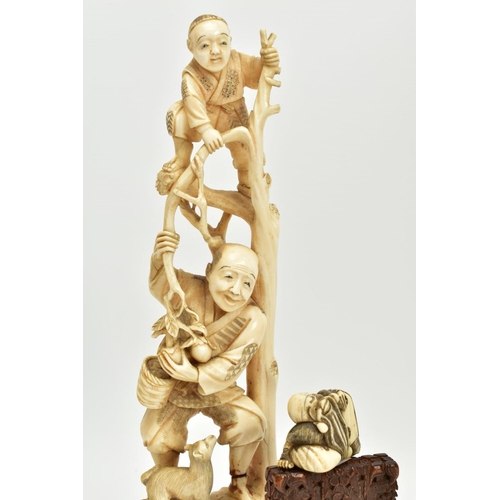 178 - A LATE 19TH CENTURY JAPANESE IVORY OKIMONO, carved as a child standing at the top of some branches w... 