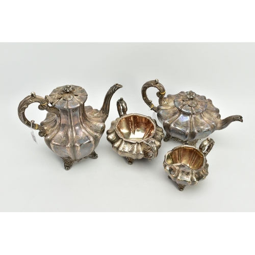 179 - A FOUR PIECE SILVER TEASET, to include an elaborate foliate engraved wavy body of melon shape, scrol... 