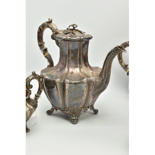 179 - A FOUR PIECE SILVER TEASET, to include an elaborate foliate engraved wavy body of melon shape, scrol... 