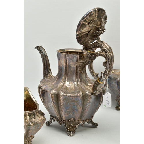 179 - A FOUR PIECE SILVER TEASET, to include an elaborate foliate engraved wavy body of melon shape, scrol... 