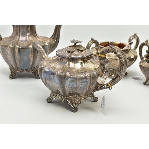 179 - A FOUR PIECE SILVER TEASET, to include an elaborate foliate engraved wavy body of melon shape, scrol... 