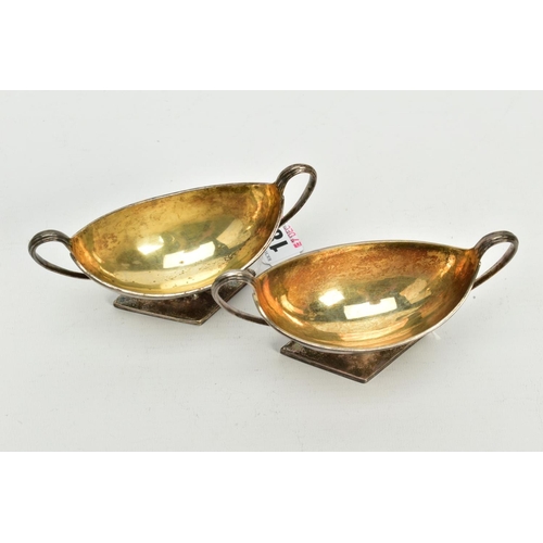 188 - A NEAR PAIR OF GEORGE III STERLING SILVER SALTS, each twin handled oval urn form on a raised lozenge... 