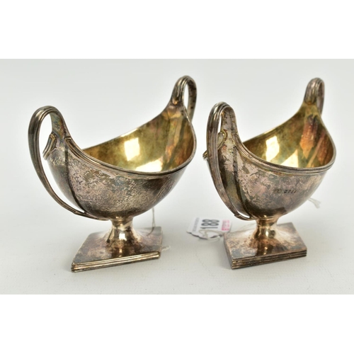 188 - A NEAR PAIR OF GEORGE III STERLING SILVER SALTS, each twin handled oval urn form on a raised lozenge... 